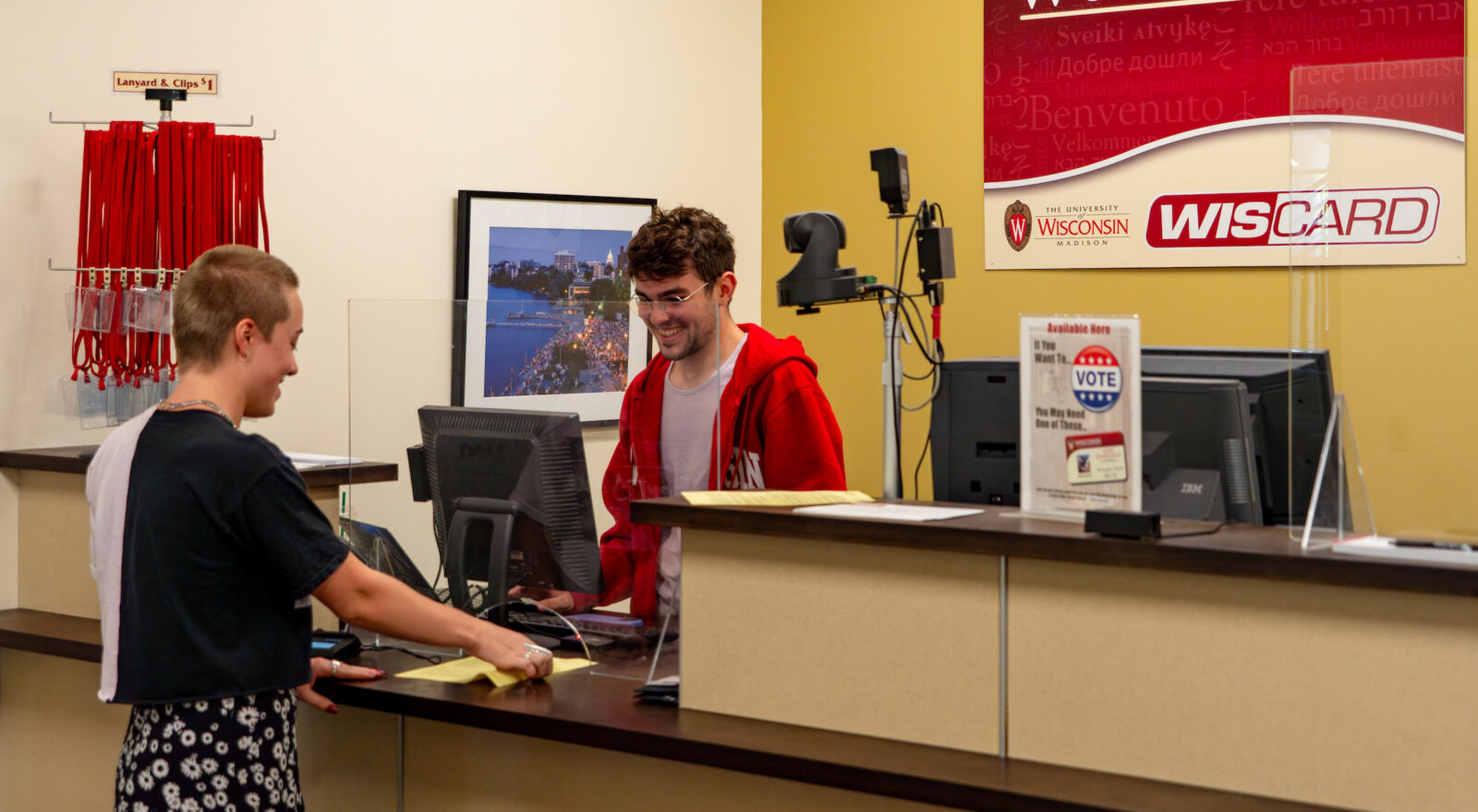A student receiving assistance at the Wiscard front desk.